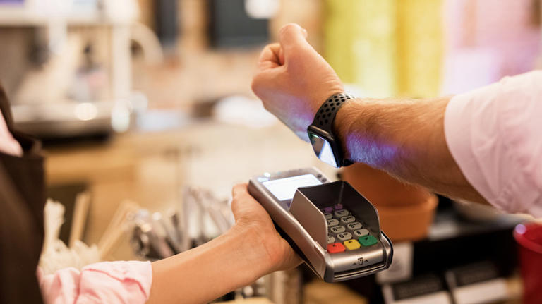 Man paying with Apple Watch