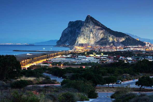 Rravel destination: Gibraltar Rock and La Linea de la Conception at blue hour - Morocco (Africa) in the background (Spain and Gibraltar/ UK)