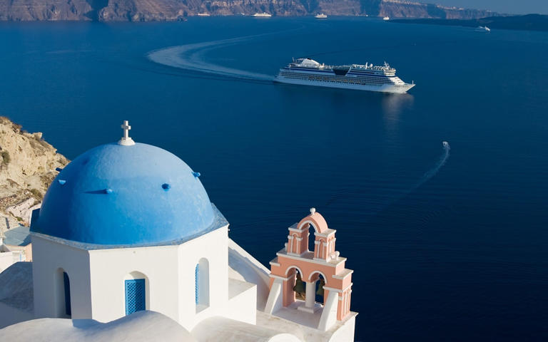 The tax on cruise ship passengers in Santorini, pictured, has been introduced in a bid to avert over-tourism