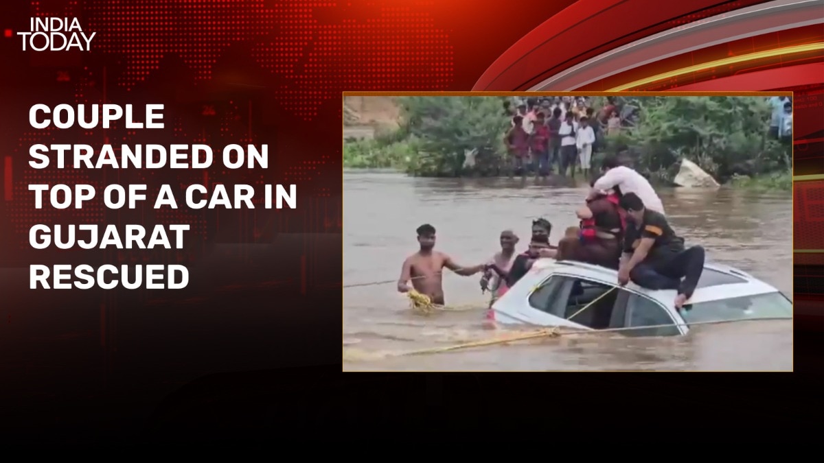 Watch: Miraculous save of Gujarat couple stranded on top of car in flood water