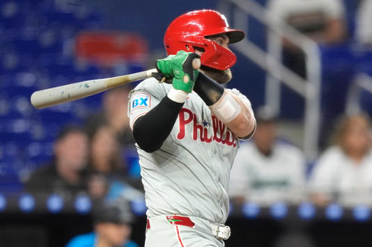 Philadelphia Phillies’ Bryce Harper follows through on an RBI single to score Johan Rojas during the ninth inning of a baseball game against the Miami Marlins, Sunday, Sept. 8, 2024, in Miami. (AP Photo/Lynne Sladky)