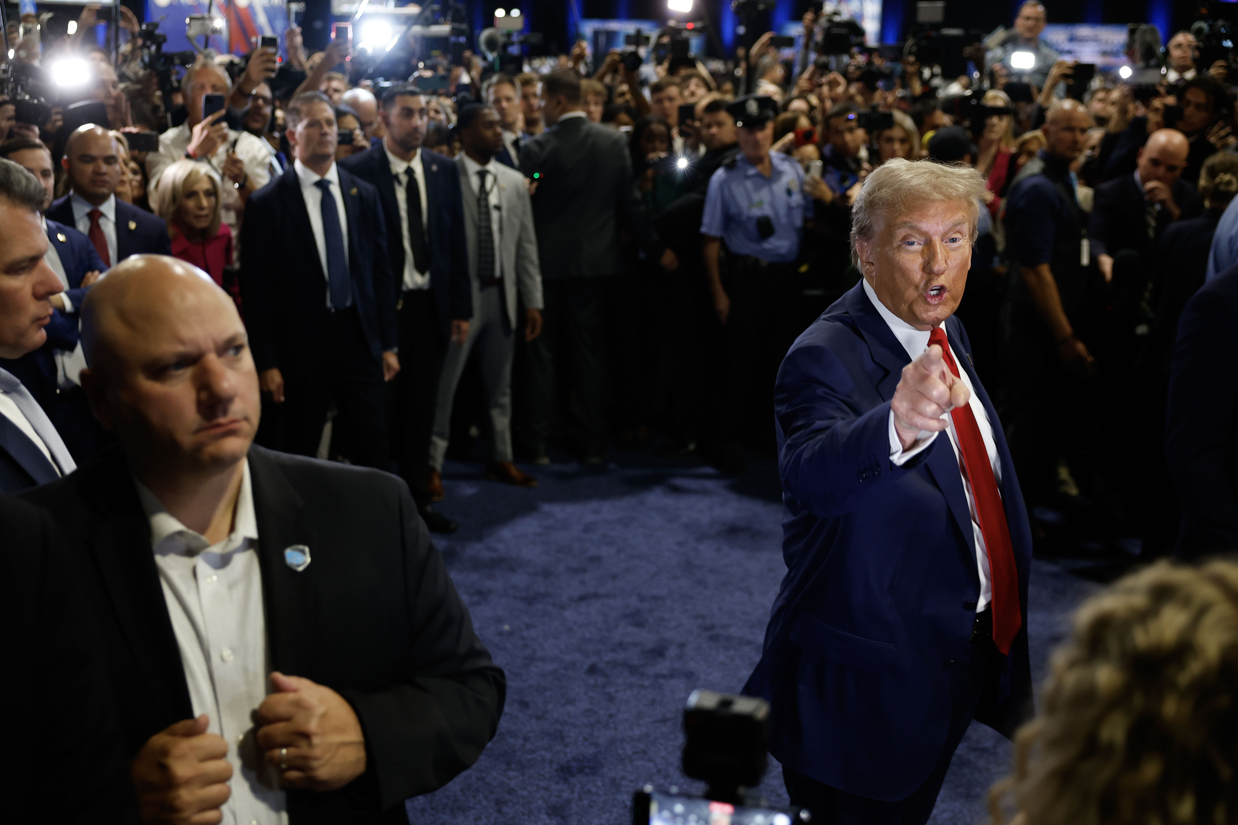 Former president Donald Trump speaks to reporters in the spin room after the presidential debate in Philadelphia on Tuesday.