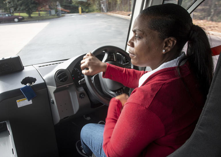 U.S. Postal Service delivery driver Avis Stonum maneuvers one the the newest fleet vehicles through the work lot of a postal facility on Thursday, Sept. 5, 2024, in Athens, Ga. (AP Photo/Ron Harris)