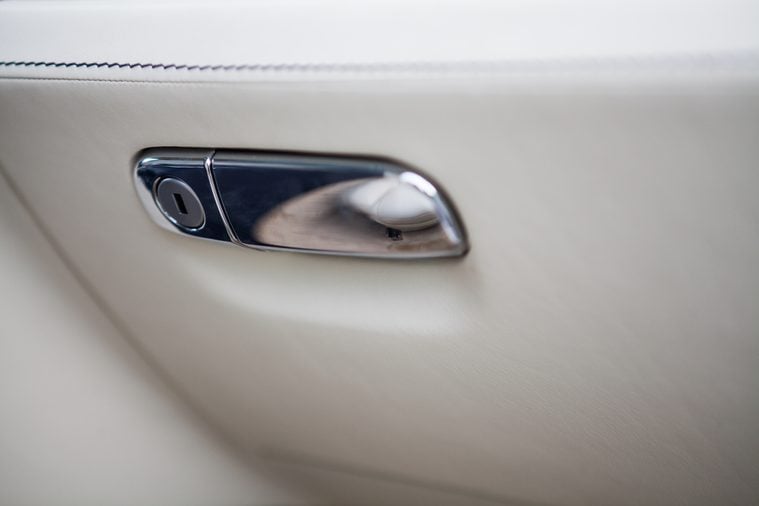 Color detail of the glove compartment in a luxury car.