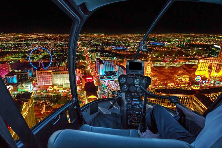 bennymarty/Getty Images Nighttime view from inside a helicopter while flying over the Las Vegas strip