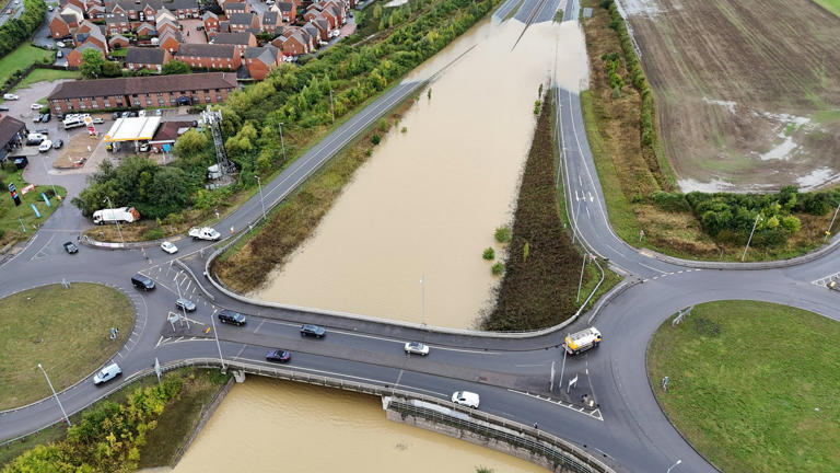 Heavy rain and localised flooding in areas of Britain, near Bedford