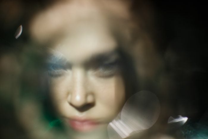 Blurred Sunny Portrait Of The Young Woman