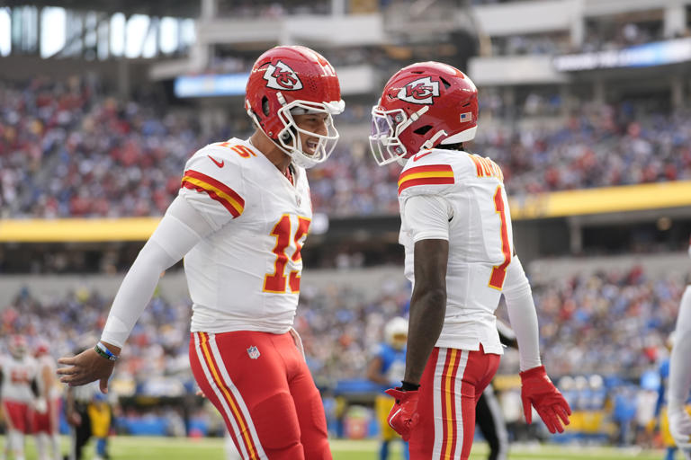 Kansas City Chiefs wide receiver Xavier Worthy, right, is celebrates after catching a 54-yard touchdown pass from teammate Patrick Mahomes, left, during the first half of an NFL football game against the Los Angeles Chargers Sunday, Sept. 29, 2024, in Inglewood, Calif. (AP Photo/Ashley Landis)