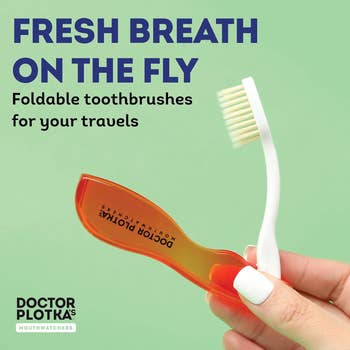 A hand holds a foldable toothbrush with an orange cover. Text reads,