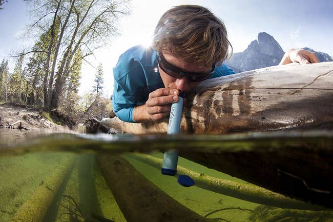 model drinks water from gross algae water using straw
