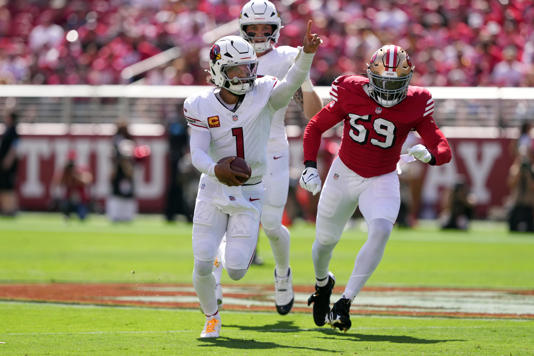 Arizona Cardinals quarterback Kyler Murray (1) gestures while rushing for a touchdown against the San Francisco 49ers linebacker De'Vondre Campbell (59) during the first quarter at Levi's Stadium on Oct. 6, 2024.