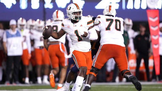 Oct 5, 2024; Berkeley, California, USA; Miami Hurricanes quarterback Cam Ward (1) throws a pass against the California Golden Bears during the first quarter at California Memorial Stadium. Mandatory Credit: Darren Yamashita-Imagn Images | Darren Yamashita-Imagn Images