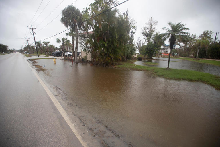 Water sits on the landscape on Sanibel Island on as Hurricane Milton approaches on Monday, Oct. 7, 2024.