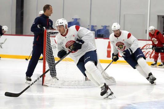 Florida Panthers center Carter Verhaeghe, left, and center Aleksander Barkov, right, skate during NHL hockey training camp Thursday, Sept. 19, 2024, in Fort Lauderdale, Fla. (AP Photo/Lynne Sladky)