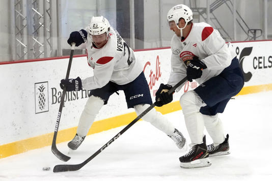 Florida Panthers center Carter Verhaeghe (23) and center Sam Reinhart, right, do drills during NHL hockey training camp Thursday, Sept. 19, 2024, in Fort Lauderdale, Fla. (AP Photo/Lynne Sladky)