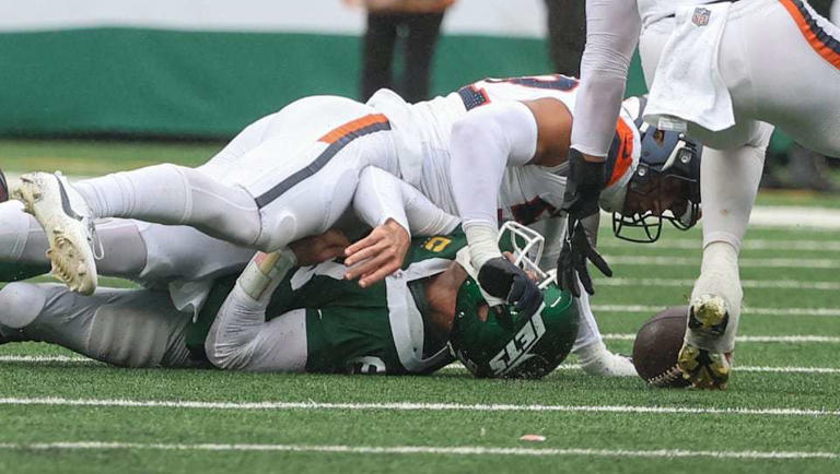 New York Jets quarterback Aaron Rodgers (8) loses the ball as he is sacked by Denver Broncos linebacker Jonah Elliss (52) during the fourth quarter, Sunday, Sept. 29 2024, in East Rutherford, N.J. The Broncos won, 10-9.