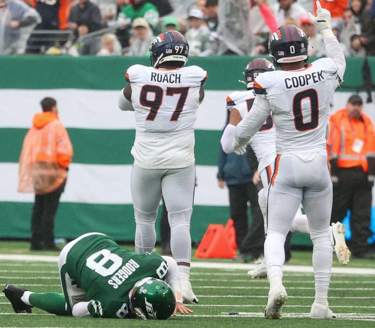 New York Jets quarterback Aaron Rodgers (8) is slow to get up after he was sacked by Denver Broncos defense during the fourth quarter, Sunday, Sept. 29 2024, in East Rutherford, N.J. The Broncos won, 10-9.