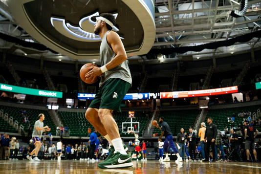 Phoenixs Devin Booker (1) plays in the Michigan State Nike Book 1 during a NBA preseason game between the Phoenix Suns and Detroit Pistons at the Breslin Center in East Lansing, Michigan, on Tuesday, Oct. 8, 2024.