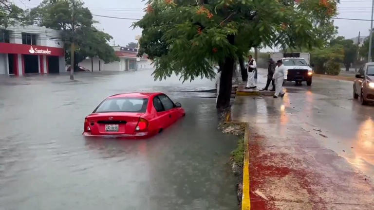 A car is submerged in flooded streets in flooding caused by Hurricane Helene in Quintana Roo, Mexico, on Wednesday. - Governor of Quintana Roo Mara Lezama/X