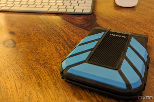 Adata HD710 Pro 2TB hard drive on a brown desk
