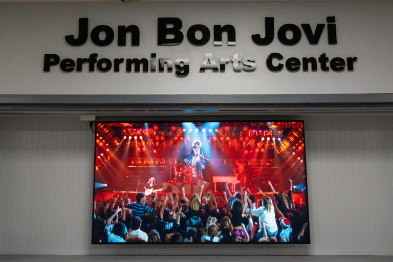 Jon Bon Jovi visited his alma mater Sayreville High School on Tuesday for a dedication of the new Performing Arts Center in his name. Bon Jovi and former bandmate Dave Sabo of Skid Row were both inducted in the school's Hall of Fame.