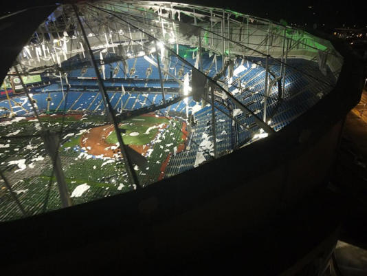 A drone image above Tropicana Field, home of the Tampa Bay Rays, show the shredded roof of the dome and the cots on the field, set up for first responders, among the debris, Oct. 10, 2024.