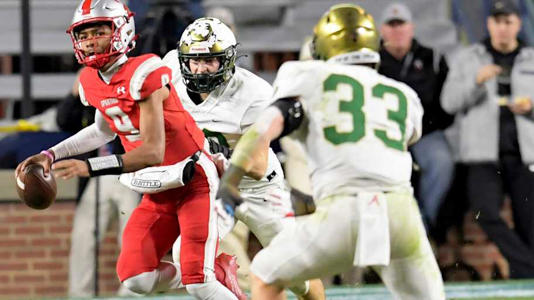 Saraland's KJ Lacey looks to pass against Mountain Brook during the AHSAA Class 6A State Football Championship Game at Jordan Hare Stadium in Auburn, Ala., on Friday December 2, 2022. | Mickey Welsh/Montgomery Advertiser / USA TODAY NETWORK