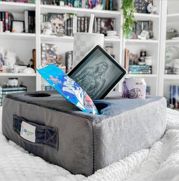 Cozy book setup with Kindle displaying