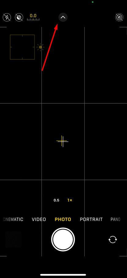 Up arrow in the Camera app.