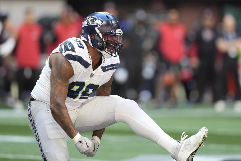 Seattle Seahawks defensive end Leonard Williams (99) reacts after sacking Atlanta Falcons quarterback Kirk Cousins during the first half of an NFL football game, Sunday, Oct. 20, 2024, in Atlanta. (AP Photo/ Brynn Anderson )