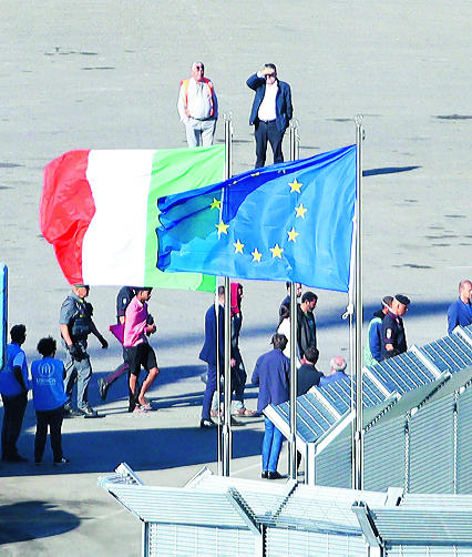 epaselect epa11661890 A group of migrants intercepted in Italian waters arrive aboard an Italian navy boat at Shengjin, Albania, 16 October 2024. Italy has begun sending migrants rescued in the Mediterranean to detention centers in Albania, where their asylum claims will be processed. The plan, finalized in February 2024, allows Italy to transfer up to 36,000 asylum seekers to Albania annually, with the goal of deterring migrants from attempting to reach Italy. While the Italian government and some EU leaders support the program, human rights groups criticize it for potentially putting migrants at risk and exposing them to rights violations. EPA/MALTON DIBRA