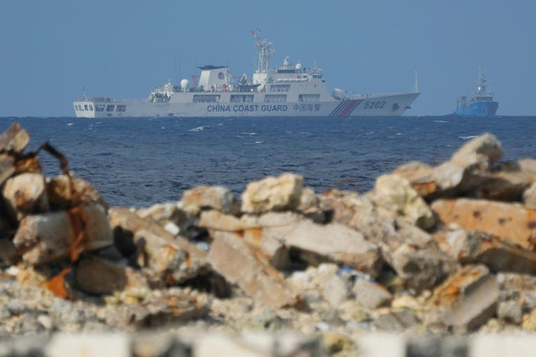 A Chinese coastguard vessel is pictured sailing past Thitu Island in December last year. Photo: AP