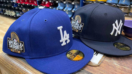 Lids, inside the Mall of Victor Valley, received a fresh shipment of Los Angeles Dodgers and New York Yankees hats with World Series patches on Wednesday, Oct. 23, 2024. | Jose Quintero / USA TODAY NETWORK via Imagn Images