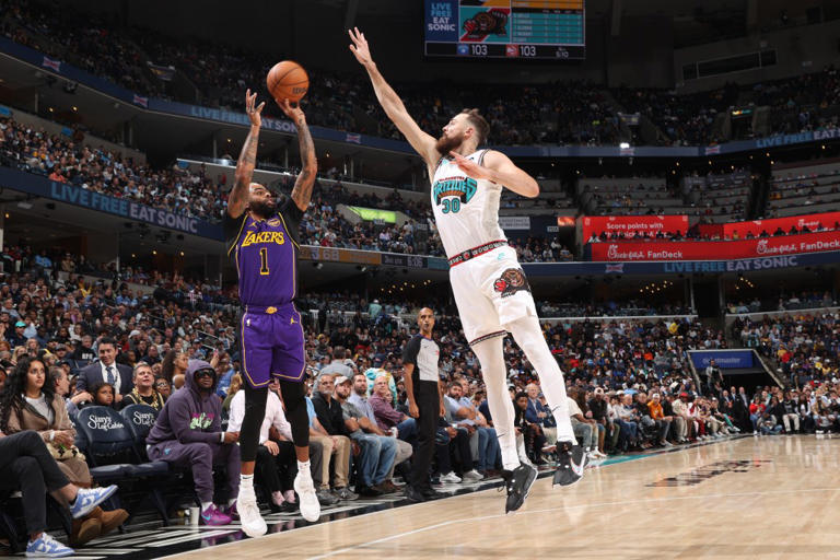 D’Angelo Russell (1) of the Los Angeles Lakers attempts a three pointer, which was blocked by Memphis Grizzlies Center Jay Huff (30). NBAE via Getty Images