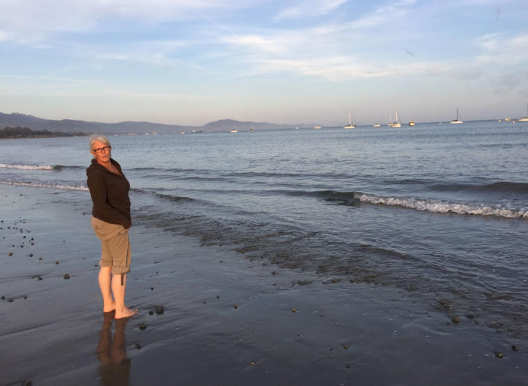 The author with her feet in the Pacific Ocean in Santa Barbara, California (2017). Courtesy of Tricia Stewart Shiu