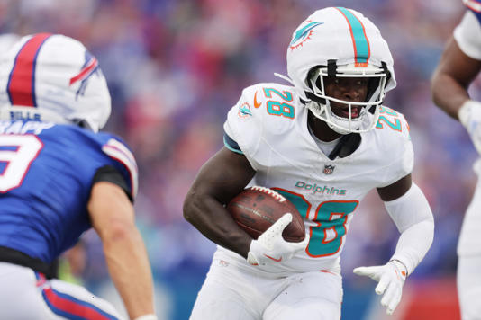 ORCHARD PARK, NEW YORK - NOVEMBER 03: De'Von Achane #28 of the Miami Dolphins carries the ball against the Buffalo Bills during the third quarter at Highmark Stadium on November 03, 2024 in Orchard Park, N.Y.