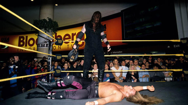 The Undertaker crushes Triple H with a Tombstone Piledriver at Penn Station