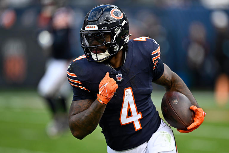 CHICAGO, ILLINOIS - NOVEMBER 10: D'Andre Swift #4 of the Chicago Bears carries the ball against the New England Patriots during the fourth quarter at Soldier Field on November 10, 2024 in Chicago, Illinois. (Photo by Quinn Harris/Getty Images)