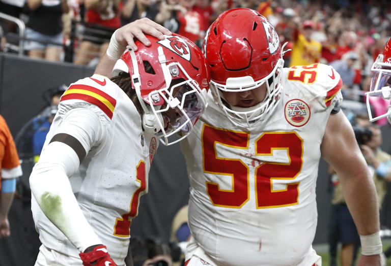 Kansas City Chiefs wide receiver Xavier Worthy (1) celebrates with center Creed Humphrey (52) after scoring a touchdown against the Las Vegas Raiders during the second half of an NFL football game Sunday, Oct. 27, 2024, in Las Vegas. (Steve Marcus/Las Vegas Sun via AP)