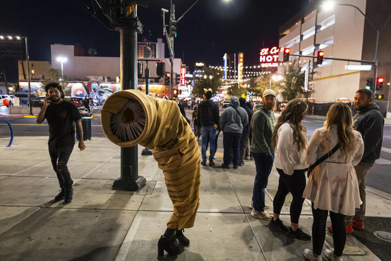 Costumed characters come out to celebrate Halloween on Fremont