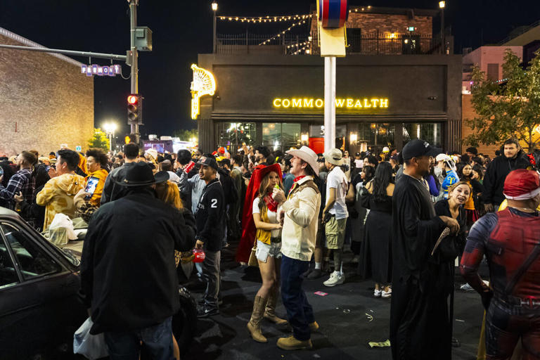 Costumed characters come out to celebrate Halloween on Fremont