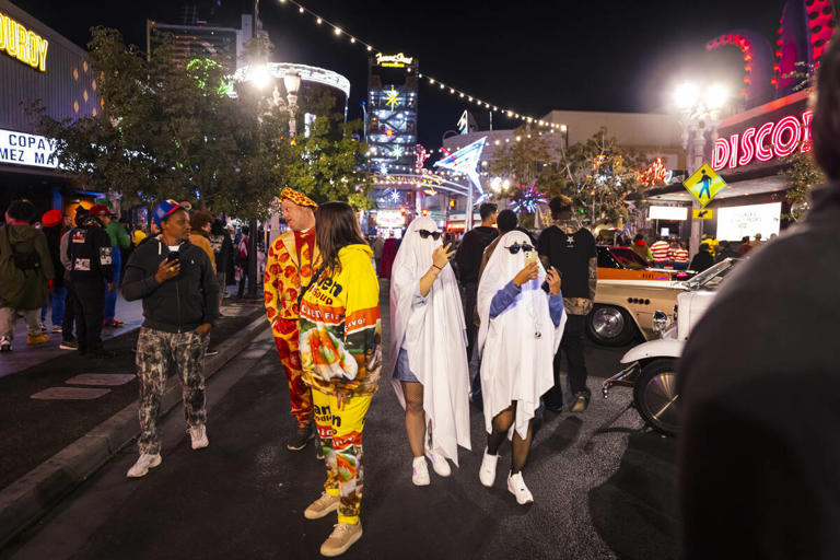 Costumed characters come out to celebrate Halloween on Fremont