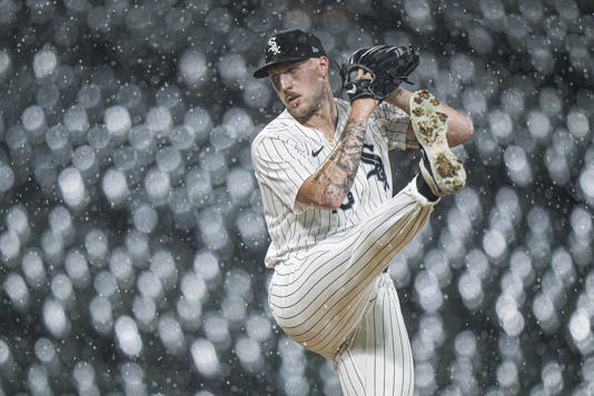 Garrett Crochet of the Chicago White Sox pitches during a rain storm against the Texas Rangers at Guaranteed Rate Field on Aug. 27, 2024, in Chicago.