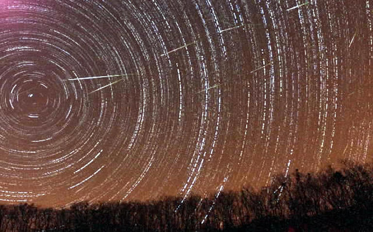 Meteor showers are caused when Earth passes through a stream of meteoroids, which are pieces of debris left behind by a comet - Yonhap/AP Photo