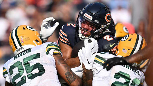 Chicago Bears wide receiver DJ Moore is tackled by the Green Bay Packers during last year's game in Chicago. | Jamie Sabau-Imagn Images