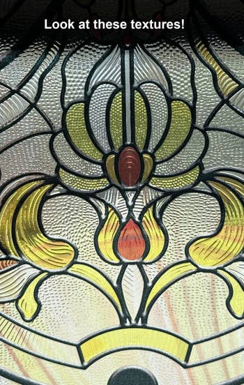 Close-up of decorative glass with intricate textures and floral patterns