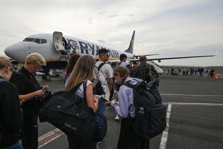 Caption: Ryannair passengers boaring at Paris-Beauvais airport, in Tille, France. Photo: Artur Widak/NurPhoto.