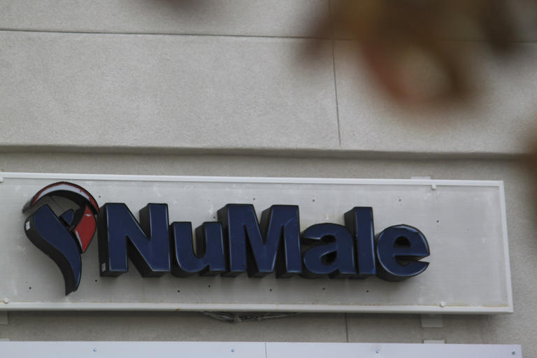 A sign for NuMale Medical Center is displayed outside a building in Albuquerque, New Mexico, Wednesday, Nov. 27, 2024. (AP Photo/Susan Montoya Bryan)