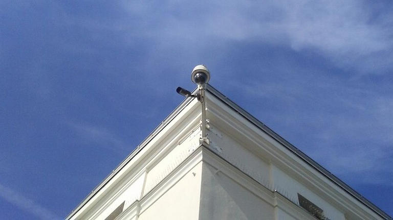 Security camera on top of a building