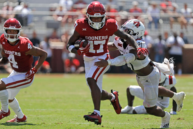 Oklahoma's Jaquaize Pettaway (17) runs past Arkansas State's Melique Straker (21) during a college football game between the University of Oklahoma Sooners (OU) and the Arkansas State Red Wolves at Gaylord Family-Oklahoma Memorial Stadium in Norman, Okla., Saturday, Sept. 2, 2023. Oklahoma won 73-0.